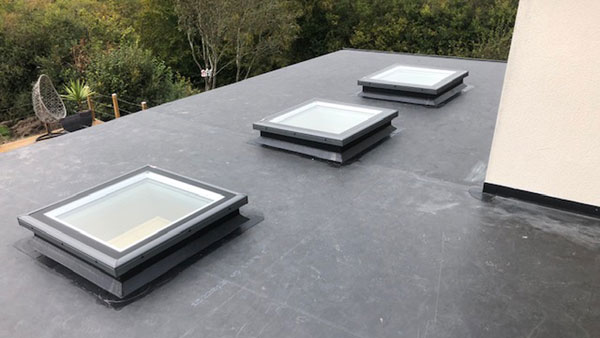 Flat roof with windows at domestic property